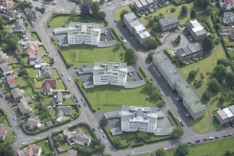 Oblique aerial view of 1-48 Ravelston Garden, looking E.