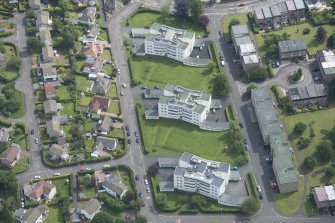 Oblique aerial view of 1-48 Ravelston Garden, looking ENE.