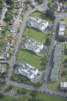 Oblique aerial view of 1-48 Ravelston Garden, looking NE.