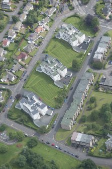 Oblique aerial view of 1-48 Ravelston Garden, looking NNE.