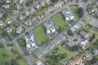 Oblique aerial view of 1-48 Ravelston Garden, looking N.