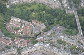 Oblique aerial view of Dean Village, Damside, Dean Path, Dean Bridge, Rothesay Terrace and Drumsheugh Baths, looking NNW.