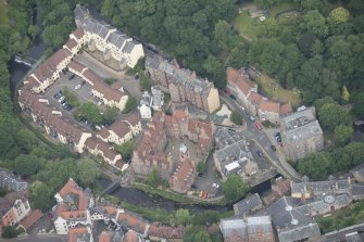 Oblique aerial view of Dean Village, Damside, Dean Path, Dean Bridge, Rothesay Terrace and Drumsheugh Baths, looking NW.