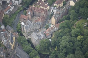 Oblique aerial view of Dean Village, Damside, and Well Court, looking WSW.