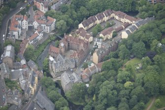Oblique aerial view of Dean Village, Damside, and Well Court, looking SW.
