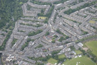 Oblique aerial view of St Bernard's Crescent, Stockbridge Church, Eton Terrace, Lennox Street, Comely Bank Road, Carlton Street, Danube Street, Oxford Terrace and Clarendon Crescent, looking S.