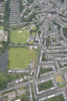 Oblique aerial view of Comely Bank Road and Edinburgh Academicals Cricket Ground, looking E.