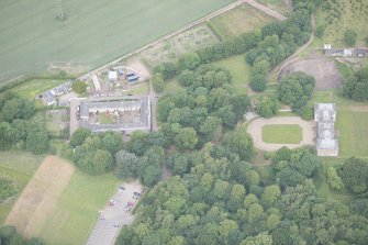 Oblique aerial view of Newhailes House and stables, looking NW.