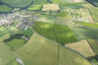 Oblique aerial view centred on the ploughed out remains of the reverse S-shaped field boundaries, looking NNW.