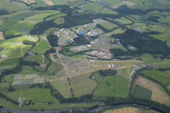 Oblique aerial view of the setting up of T in the Park at Strathallan, looking S.