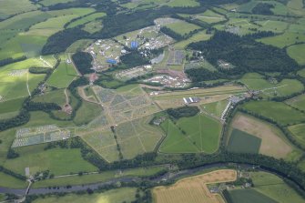 Oblique aerial view of the setting up of T in the Park at Strathallan, looking S.