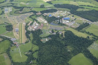 Oblique aerial view of the setting up of T in the Park at Strathallan, looking ESE.