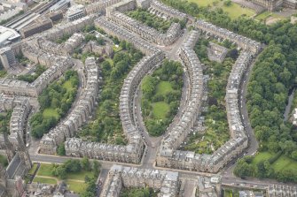 Oblique aerial view of Palmerston Place, Glencairn Crescent, Lansdowne Crescent, Grosvenor Crsecent, Douglas Crescent and Eglinton Crescent, looking SW.