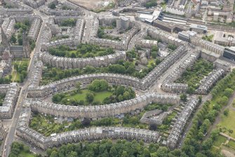 Oblique aerial view of Palmerston Place, Glencairn Crescent, Lansdowne Crescent, Grosvenor Crsecent, Douglas Crescent and Eglinton Crescent, looking SSE.