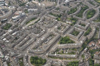 Oblique aerial view of Melville Street, Palmerston Place, Atholl Crescent, Coates Crescent and Shandwick Place, looking E.