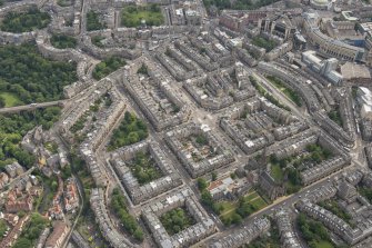 Oblique aerial view of Melville Street, Palmerston Place, Atholl Crescent, Coates Crescent and Shandwick Place, looking E.