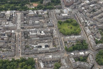 Oblique aerial view of George Street, North Castle Street, Young Street, Charlotte Square, South Charlotte Street, North Charlotte Street and Castle Street, looking S.