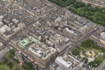 Oblique aerial view of South St David Street, George Street, Princes Street and Jenners Department Store, looking NW.