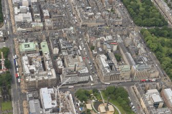Oblique aerial view of South St David Street, George Street, Princes Street and Jenners Department Store, looking WSW.