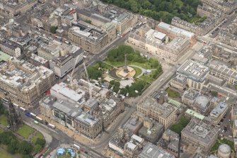 Oblique aerial view of South St Andrew Street, Princes Street and St Andrew Square, looking WNW.