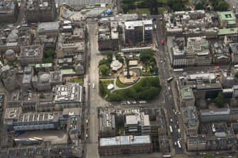 Oblique aerial view of the Scottish National Portrait Gallery, Princes Street and St Andrew Square, looking SSE.
