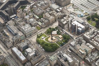 Oblique aerial view of St Andrew Square, British Linen Bank, Scottish National Portrait Gallery and Dundas House, looking ESE.
