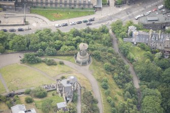 Oblique aerial view of the Dugald Stewart's Monument, Rock House and Observatory House, looking SSW.