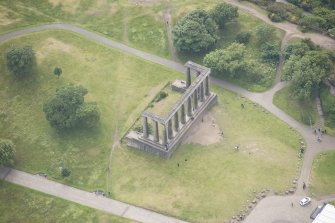 Oblique aerial view of the Calton Hill National Monument, looking SSE.