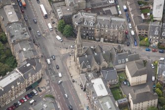 Oblique aerial view of Pilrig Dalmeny Street Church, 2,4,6 Pilrig Street, 1 Pilrig Place and Pilrig Dalmeny Street Church Hall, looking SW.