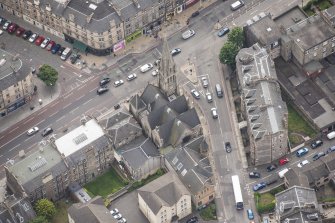 Oblique aerial view of Pilrig Dalmeny Street Church, 2,4,6 Pilrig Street, 1 Pilrig Place and Pilrig Dalmeny Street Church Hall, looking SSE.
