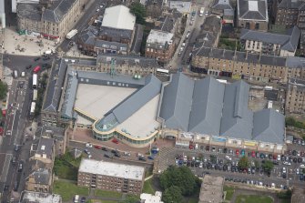 Oblique aerial view of Leith Waterworld and Leith Central Station Offices, looking NE.