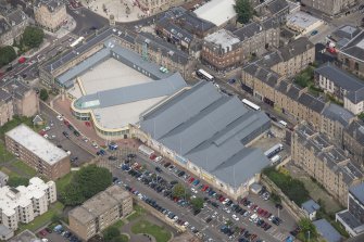 Oblique aerial view of Leith Waterworld and Leith Central Station Offices, looking NNW.