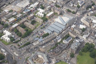 Oblique aerial view of Leith Waterworld, Leith Academy Primary School and Leith Central Station Offices, looking N.