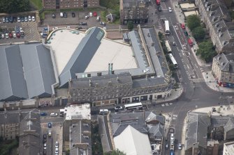 Oblique aerial view of Leith Waterworld and Leith Central Station Offices, looking SW.