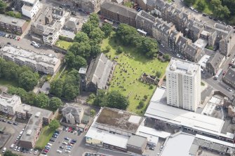 Oblique aerial view of Trinity House and South Leith Parish Church and Churchyard, looking ENE.