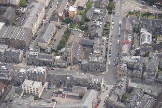 Oblique aerial view of St John's East Church, Bank of Scotland, 31-33 Queen Charlotte Street, 41 Queen Charlotte Street, 75-79 Constitution Street and 35-39 Queen Charlotte Street, looking ESE.