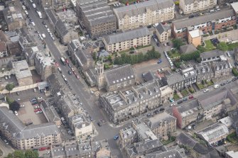 Oblique aerial view of St John's East Church and Bank of Scotland, looking NE.