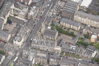 Oblique aerial view of St John's East Church, Bank of Scotland, 31-33 Queen Charlotte Street, 41 Queen Charlotte Street, 75-79 Constitution Street and 35-39 Queen Charlotte Street, 41 Queen Charlotte Street, 75-79 Constitution Street and 35-39 Queen Charlotte Street, looking N.