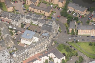 Oblique aerial view of St Thomas' Church and Leith Hospital, looking NNW.