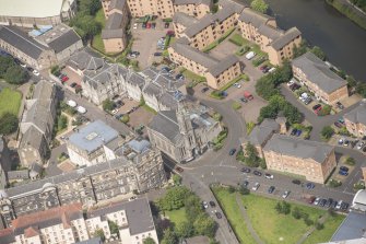 Oblique aerial view of St Thomas' Church and Leith Hospital, looking NW.