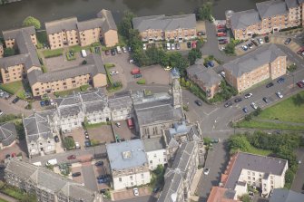Oblique aerial view of Quayside Mills, looking NNE.