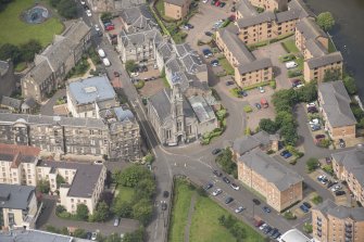 Oblique aerial view of St Thomas' Church and Leith Hospital, looking WNW.