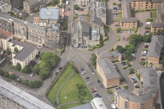 Oblique aerial view of St Thomas' Church and Leith Hospital, looking W.