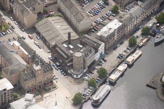 Oblique aerial view of Leith Signal Tower and Leith Sailors' Home, looking SE.