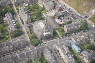 Oblique aerial view of North Leith Parish Church, Church hall and Beadle's House, looking WSW.