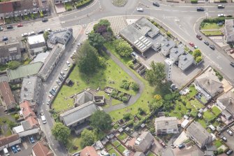 Oblique aerial view of St Triduana's Chapel, Restalrig Parish Church and Churchyard, looking S.