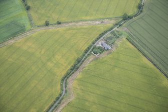 Oblique aerial view of the cropmarks of the West Mains fort, looking NE.