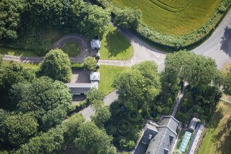 Oblique aerial view of Cairness House South Lodge, looking E.