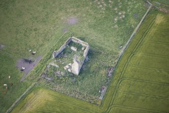 Oblique aerial view of Inverallochy Castle, looking SSW.