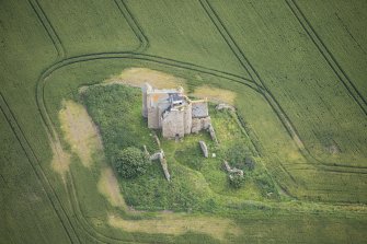 Oblique aerial view of Inchdrewer Castle, looking NE.